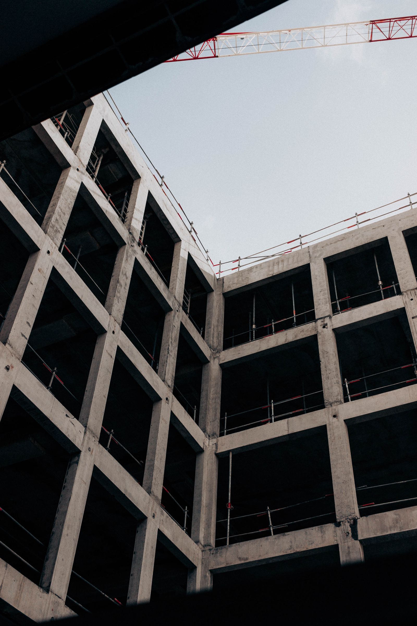A concrete commercial building under construction — the kind of job these go / no-go calls are made on.