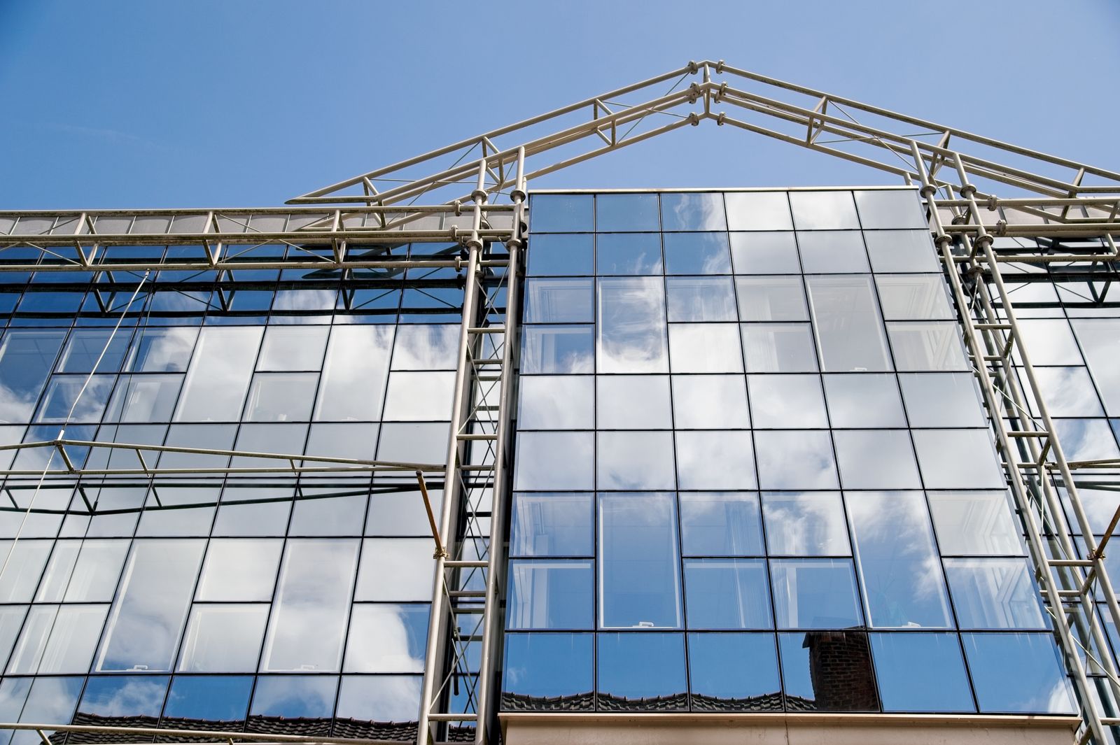 A commercial glass curtain-wall façade — the glazing trade in the example opportunity.